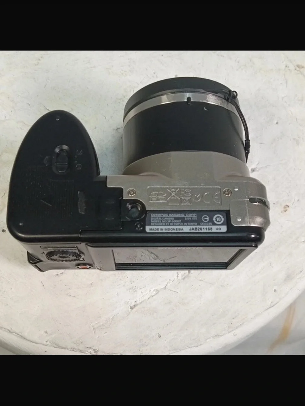 Olympus Silver Digital Camera with Black Grip and Lens Cap